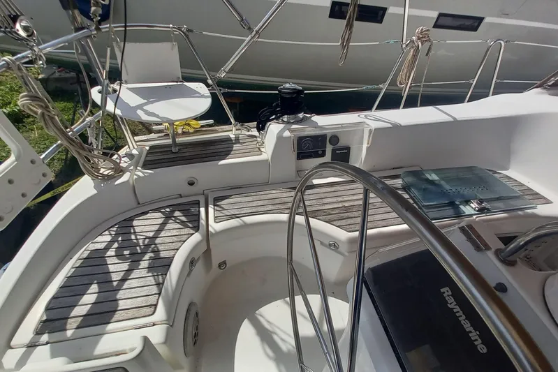 Kasoumai Yacht Photos Pics Cockpit of 2007 Beneteau 423 sailboat with steering wheel and navigation equipment.