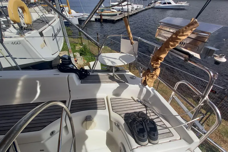 Kasoumai Yacht Photos Pics 2007 Beneteau 423 sailboat deck with shoes, grill, and marina view.