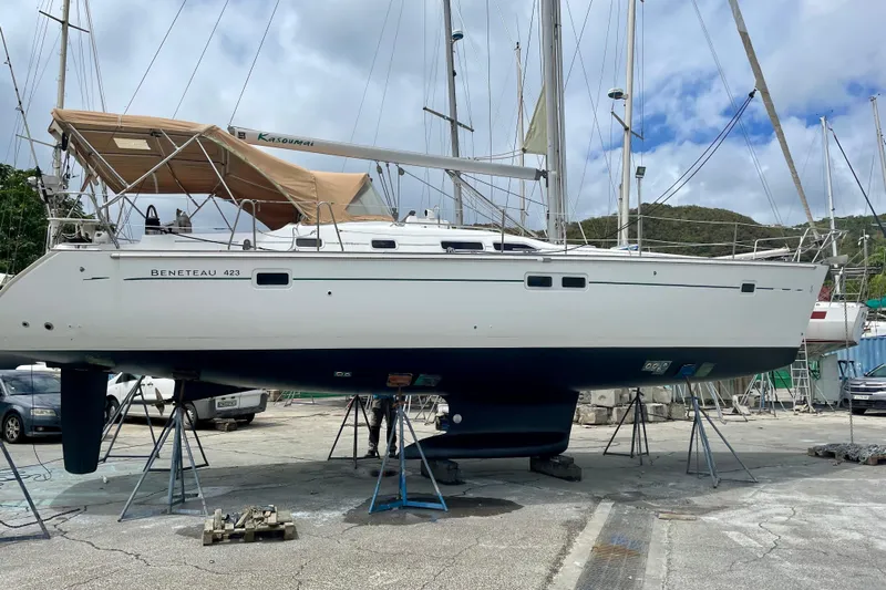 Kasoumai Yacht Photos Pics 2007 Beneteau 423 sailboat on stands in a marina, under a cloudy sky.