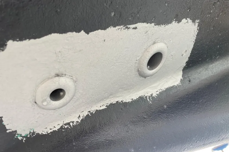 Kasoumai Yacht Photos Pics Close-up of a 2007 Beneteau 423 hull with two through-hull fittings.