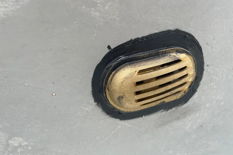 Kasoumai Yacht Photos Pics Close-up of a brass vent on a 2007 Beneteau 423 boat hull.