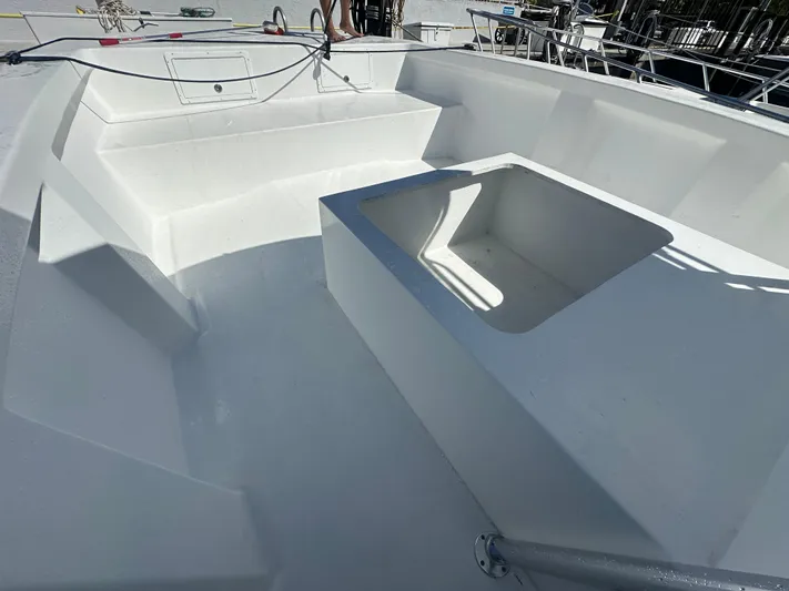  Yacht Photos Pics 2025 AmeraCat 395 boat interior with spacious seating and storage area.