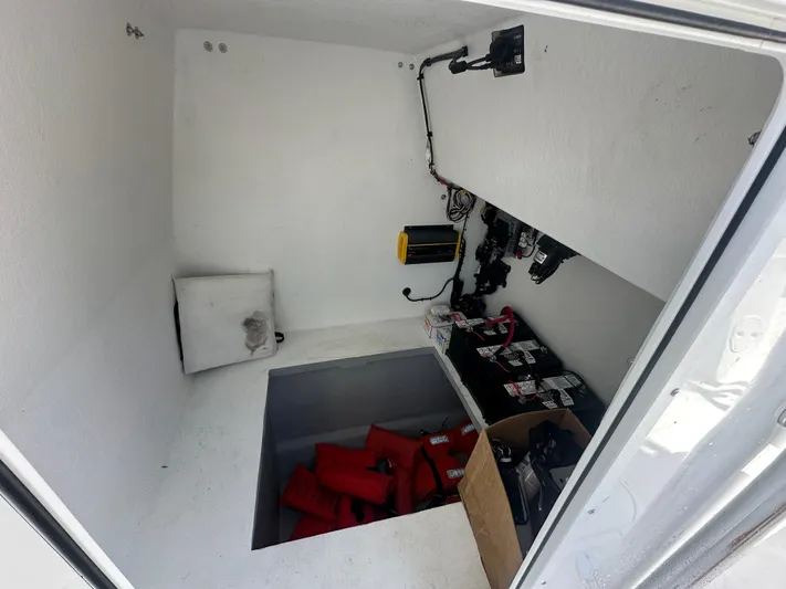 Yacht Photos Pics Storage compartment of 2025 AmeraCat 395 boat with equipment and life jackets.