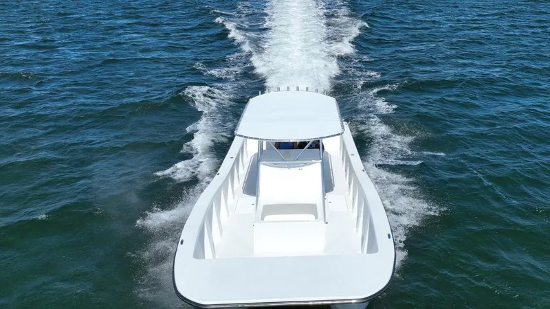  Yacht Photos Pics 2025 AmeraCat 395 boat cruising on open water, aerial view.