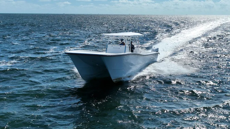  Yacht Photos Pics 2025 AmeraCat 395 boat cruising on open ocean waters.