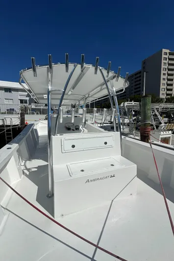  Yacht Photos Pics 2025 AmeraCat 395 boat with sleek design and modern features, docked under clear blue sky.