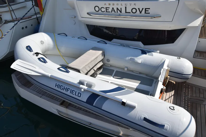 Ocean Love Yacht Photos Pics Inflatable boat docked on Absolute 50 Fly yacht, 2023 model, named "Ocean Love."