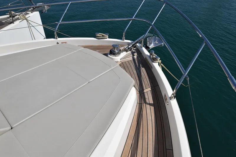 Ocean Love Yacht Photos Pics Bow view of 2023 Absolute 50 Fly yacht with teak deck and sunpad.