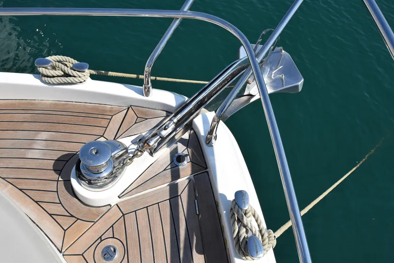 Ocean Love Yacht Photos Pics Bow of 2023 Absolute 50 Fly yacht with anchor and teak decking.