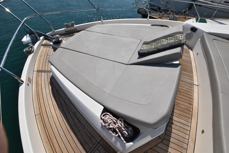 Ocean Love Yacht Photos Pics 2023 Absolute 50 Fly yacht with spacious sunbathing area and elegant deck design.