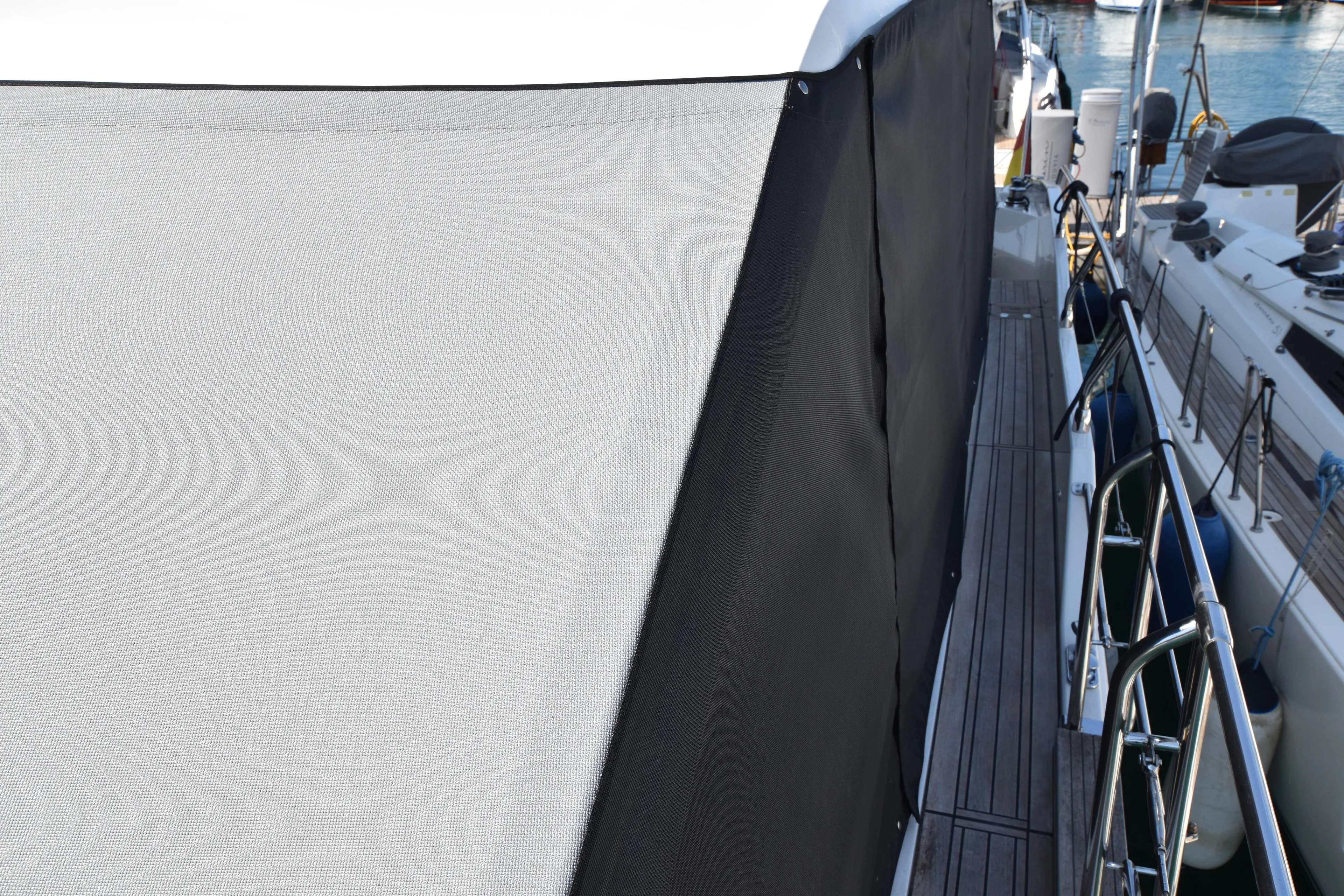 Ocean Love Yacht Photos Pics 2023 Absolute 50 Fly yacht with protective cover, docked alongside other boats.