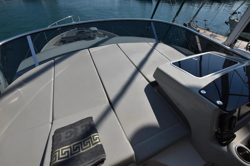 Ocean Love Yacht Photos Pics Luxurious 2023 Absolute 50 Fly yacht deck with sunbathing area and elegant towel.