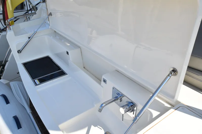 Ocean Love Yacht Photos Pics Outdoor kitchen area on 2023 Absolute 50 Fly yacht with sink and grill.