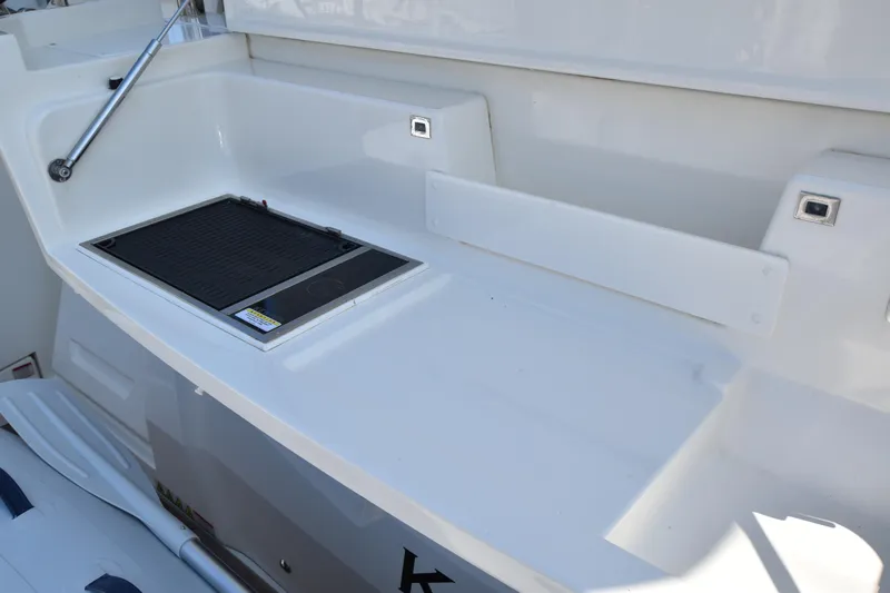 Ocean Love Yacht Photos Pics 2023 Absolute 50 Fly yacht deck with built-in grill and sleek white finish.