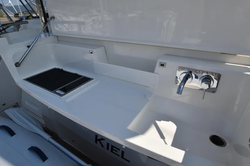 Ocean Love Yacht Photos Pics 2023 Absolute 50 Fly yacht deck with sink and storage area.