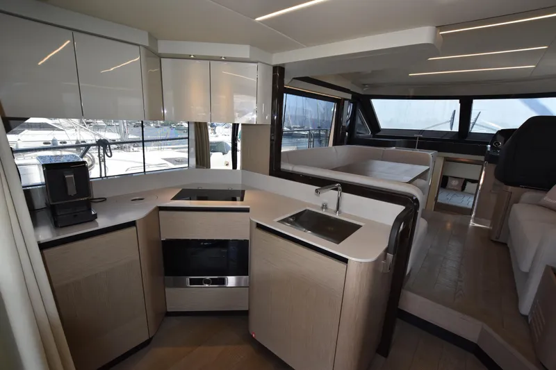 Ocean Love Yacht Photos Pics Modern kitchen interior of 2023 Absolute 50 Fly yacht with sleek design and appliances.