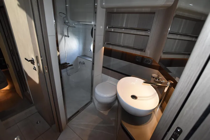 Ocean Love Yacht Photos Pics Luxurious bathroom in 2023 Absolute 50 Fly yacht, featuring modern fixtures and elegant design.