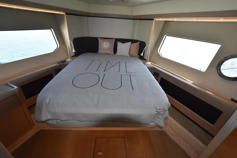 Ocean Love Yacht Photos Pics Luxurious bedroom interior of 2023 Absolute 50 Fly yacht with "Time Out" bedding.
