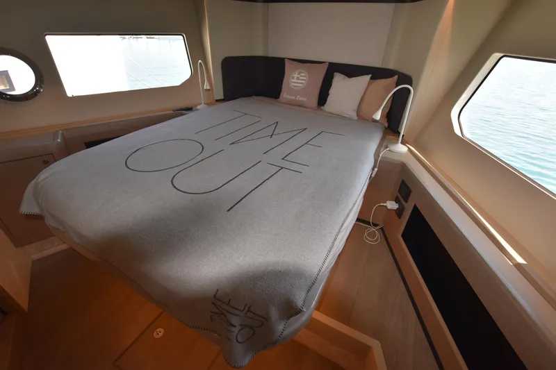 Ocean Love Yacht Photos Pics Luxurious bedroom interior of 2023 Absolute 50 Fly yacht with "Time Out" blanket.