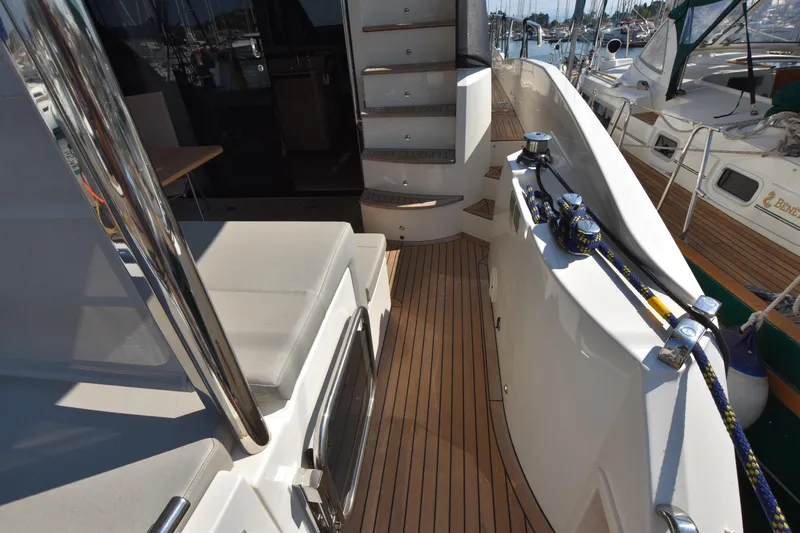 Ocean Love Yacht Photos Pics 2023 Absolute 50 Fly yacht deck with seating and mooring equipment.