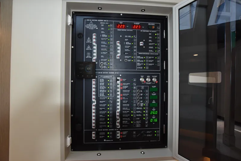 Ocean Love Yacht Photos Pics Electrical control panel on 2023 Absolute 50 Fly yacht, featuring various switches and indicators.