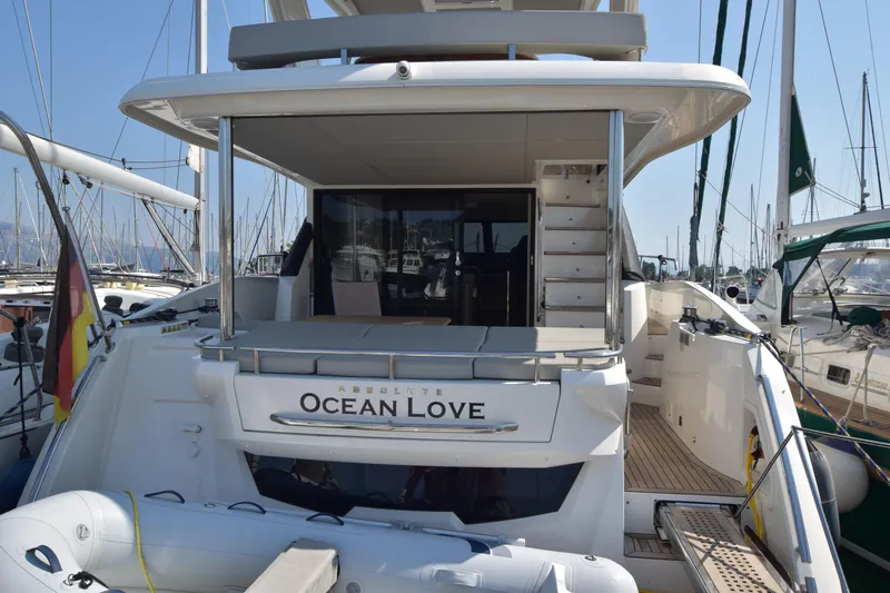 Ocean Love Yacht Photos Pics 2023 Absolute 50 Fly yacht "Ocean Love" docked at marina, rear view.