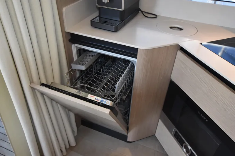 Ocean Love Yacht Photos Pics Modern kitchen with open dishwasher in 2023 Absolute 50 Fly yacht.