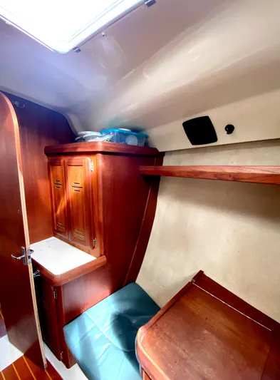 5th Row Center Yacht Photos Pics Cozy cabin interior of a 1997 Hunter 430 sailboat with wooden furnishings.