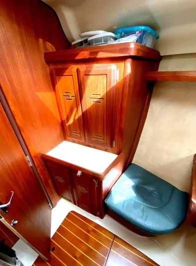 5th Row Center Yacht Photos Pics Hunter 430 yacht interior, 1997 model, featuring wooden cabinetry and seating area.