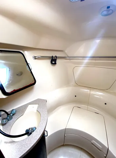 5th Row Center Yacht Photos Pics Compact bathroom in 1997 Hunter 430 sailboat with sink, mirror, and storage.