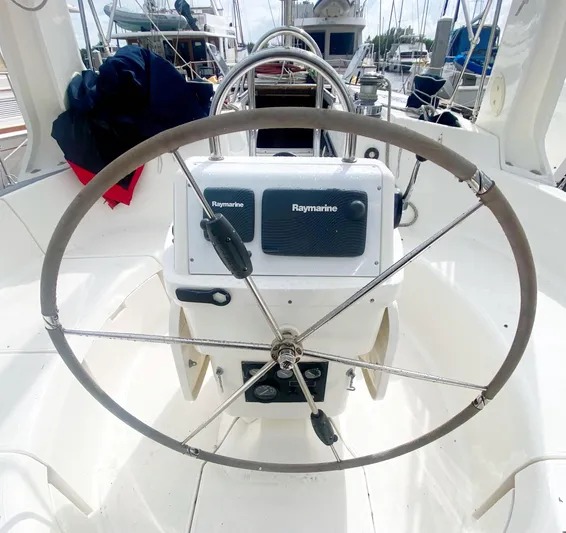 5th Row Center Yacht Photos Pics Steering wheel of a 1997 Hunter 430 sailboat with Raymarine equipment.