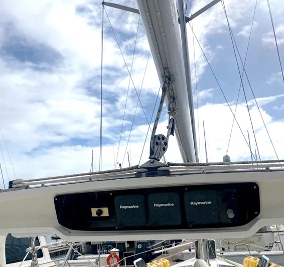 5th Row Center Yacht Photos Pics Hunter 430 sailboat mast with Raymarine equipment, 1997 model, under a partly cloudy sky.