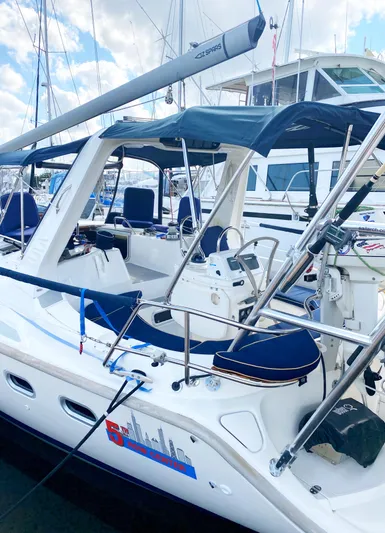 5th Row Center Yacht Photos Pics 1997 Hunter 430 sailboat docked, featuring a spacious cockpit and sleek design.