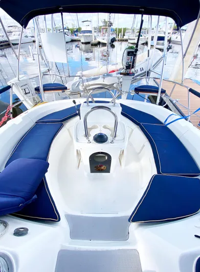 5th Row Center Yacht Photos Pics Cockpit of a 1997 Hunter 430 sailboat with blue seating and marina view.