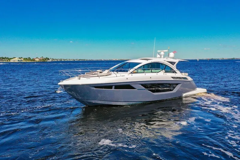  Yacht Photos Pics 2020 Cruisers Yachts 50 Cantius on open water under clear blue sky.