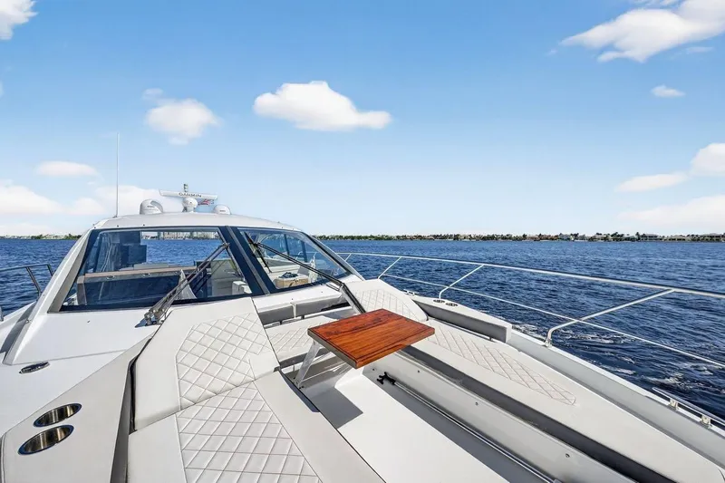  Yacht Photos Pics 2020 Cruisers Yachts 50 Cantius on open water, featuring sleek deck and seating area.