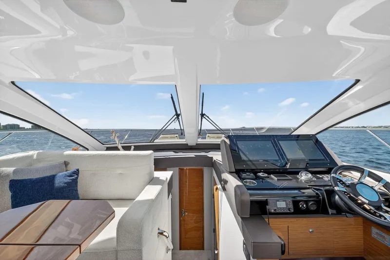  Yacht Photos Pics 2020 Cruisers Yachts 50 Cantius helm with modern controls and luxurious seating.
