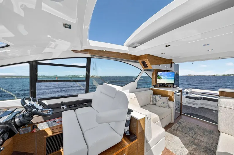  Yacht Photos Pics Luxurious interior of 2020 Cruisers Yachts 50 Cantius with ocean view and modern amenities.