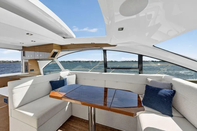  Yacht Photos Pics Luxurious interior of 2020 Cruisers Yachts 50 Cantius with elegant seating and ocean view.