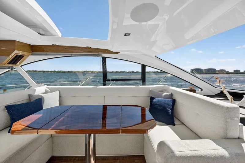  Yacht Photos Pics Luxurious interior of 2020 Cruisers Yachts 50 Cantius with elegant seating and ocean view.