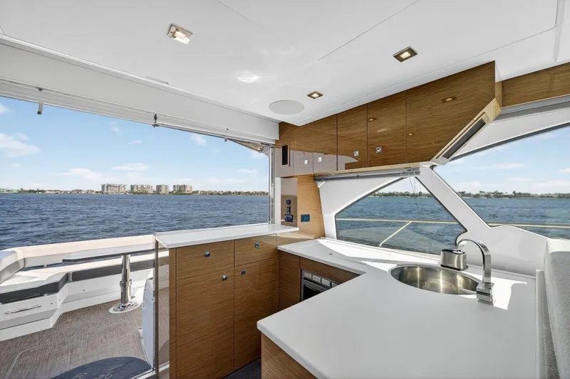  Yacht Photos Pics Interior of 2020 Cruisers Yachts 50 Cantius with modern kitchen and ocean view.
