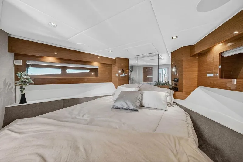  Yacht Photos Pics Luxurious bedroom interior of 2020 Cruisers Yachts 50 Cantius with modern design elements.