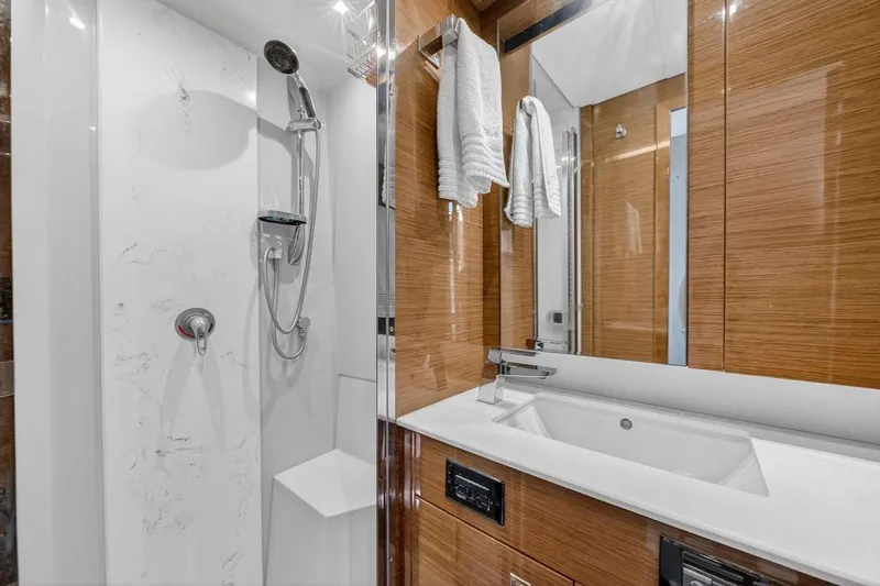  Yacht Photos Pics Luxurious bathroom in 2020 Cruisers Yachts 50 Cantius, featuring modern shower and sleek vanity.