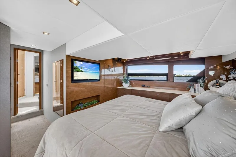  Yacht Photos Pics Luxurious bedroom interior of 2020 Cruisers Yachts 50 Cantius with modern decor and scenic views.