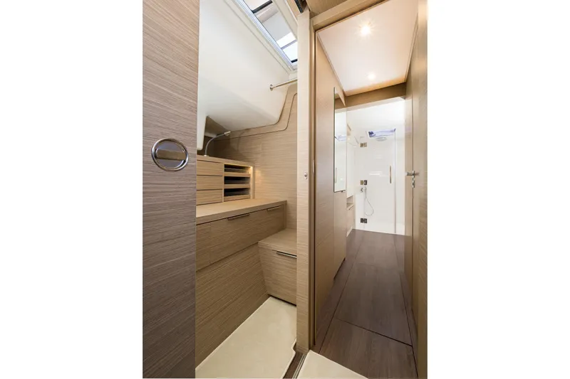 Catwalk Yacht Photos Pics Interior of 2023 Lagoon LAGOON 51 yacht, featuring modern wood finishes and sleek design.