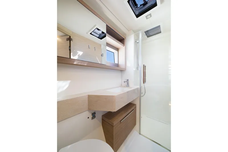 Catwalk Yacht Photos Pics Modern bathroom interior of 2023 Lagoon LAGOON 51 yacht, featuring sleek design and fixtures.