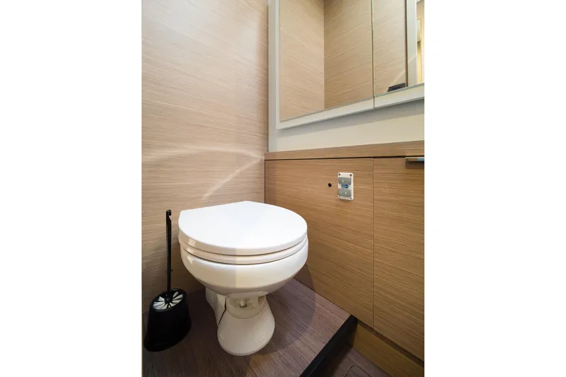 Catwalk Yacht Photos Pics Modern bathroom in 2023 Lagoon 51 yacht with sleek wooden cabinetry.