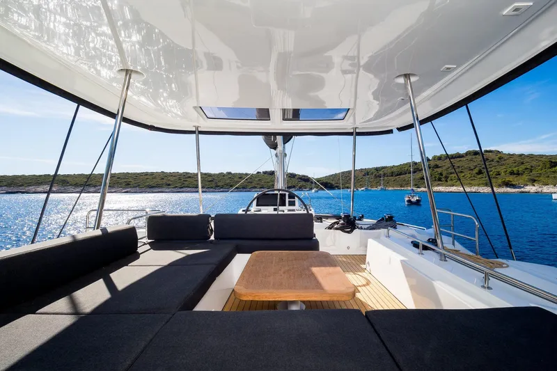 Catwalk Yacht Photos Pics Luxurious 2023 Lagoon 51 yacht interior with scenic ocean view.