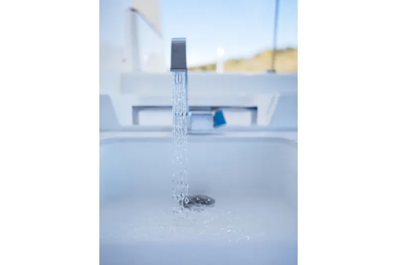 Catwalk Yacht Photos Pics Running water from a modern faucet on the 2023 Lagoon LAGOON 51 yacht.