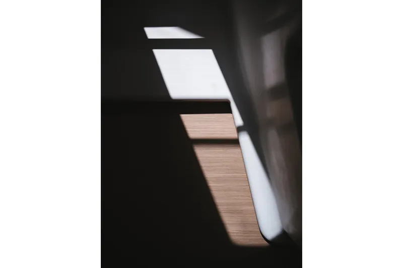 Catwalk Yacht Photos Pics Abstract light and shadow on Lagoon 51 yacht interior, 2023 model.